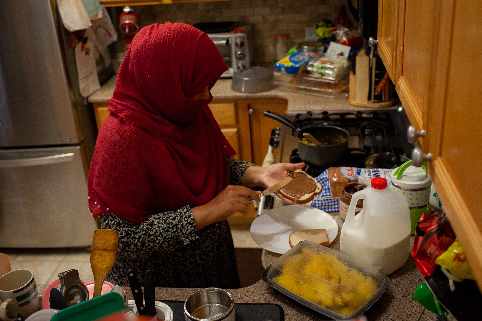 Huma Quadri makes lunch for her children, Zubeida and Yasir Syed, in Glendale Heights, Ill., Nov. 11, 2022. Photo by Michelle Kanaar/Borderless Magazine