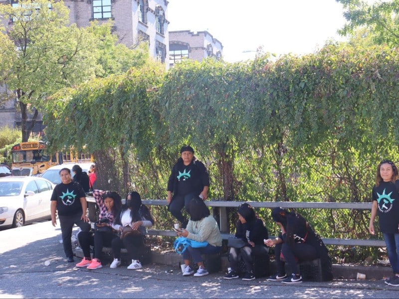 A line of women waiting for work at La Parada, accompanied by Liberty Workers staff. Photo by Andrea Pineda-Salgado