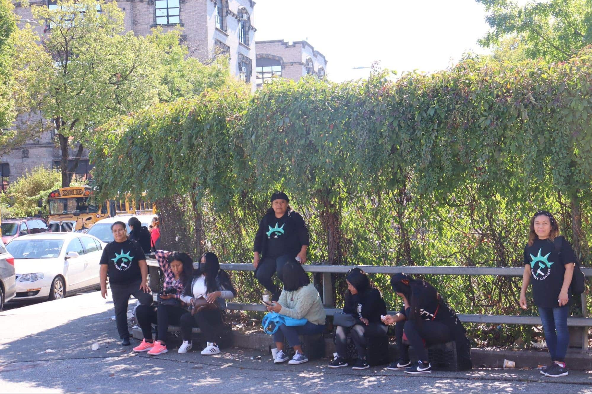 A line of women waiting for work at La Parada, accompanied by Liberty Workers staff. Photo by Andrea Pineda-Salgado